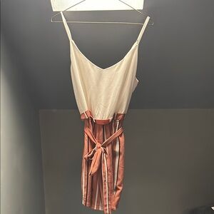 Elegant Striped romper with a white top.